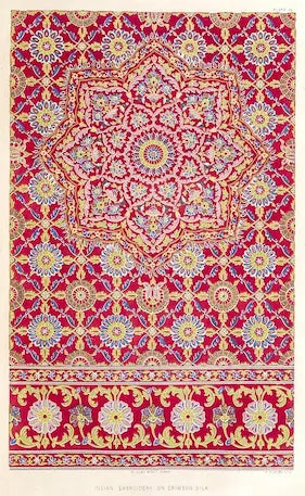 Decorative rug with intricate floral pattern on a red background