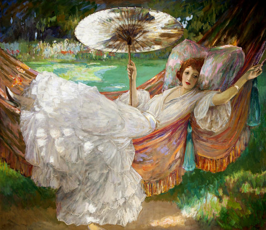 Woman in a white dress lounging in a hammock with an umbrella, surrounded by nature.