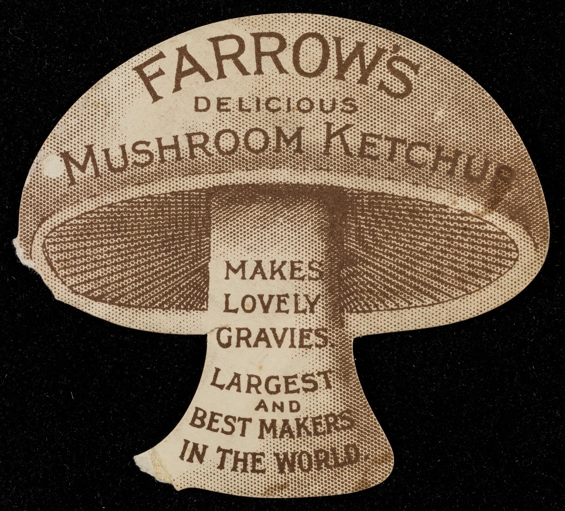 Mushroom-shaped label for Farrow's Mushroom Ketchup on a black background