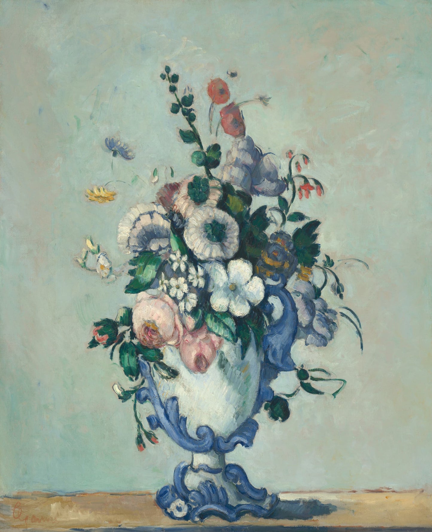 Floral arrangement in a blue vase on a light background