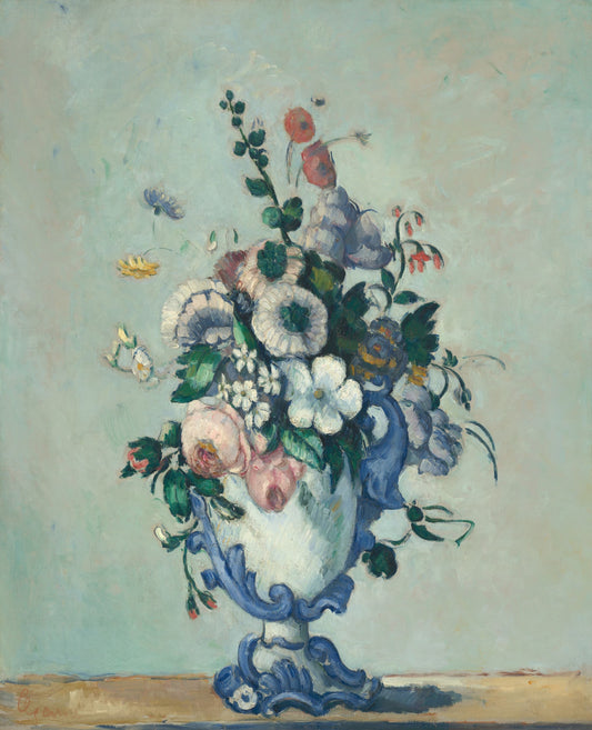Floral arrangement in a blue vase on a light background