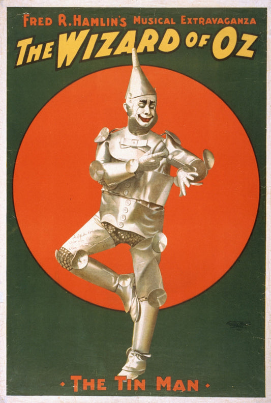 Vintage poster of 'The Wizard of Oz' featuring the Tin Man against a red circle background.