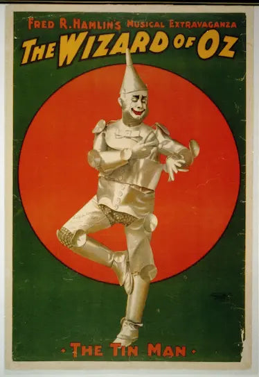 Poster of 'The Wizard of Oz' featuring the Tin Man against a red circle on a green background.