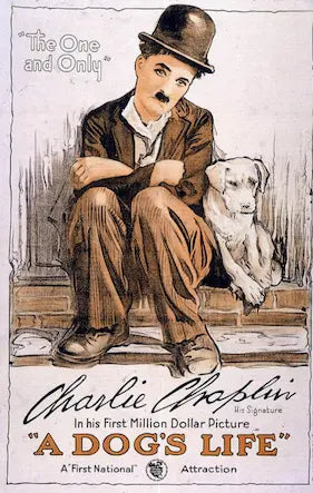 Vintage movie poster featuring Charlie Chaplin with a dog, labeled 'A Dog's Life'.