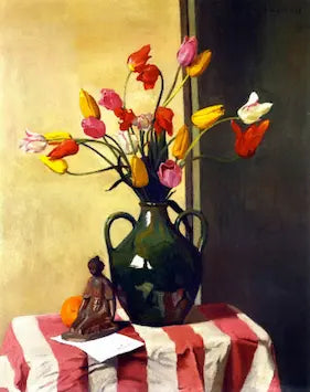 Still life with colorful tulips in a green vase on a striped tablecloth.