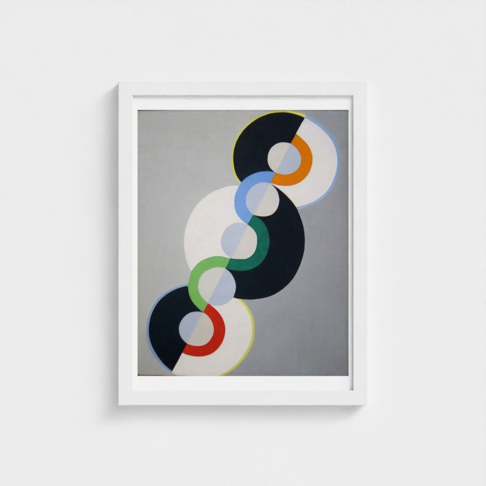 Framed abstract art print with colorful circles on a gray background