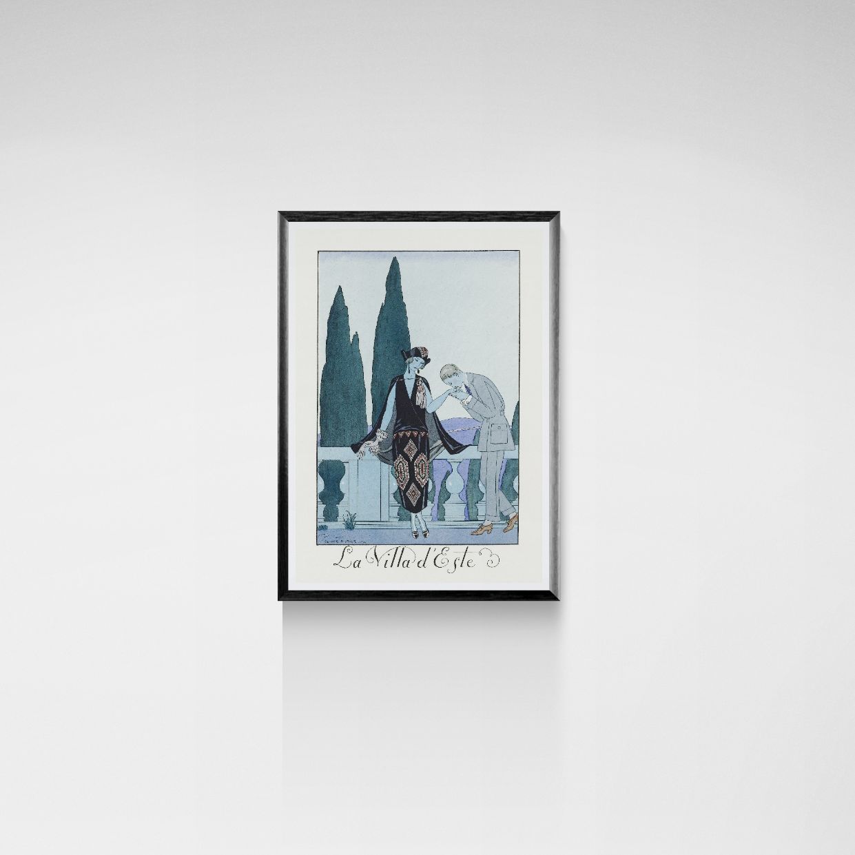 Framed artwork of a couple by a fountain on a white wall