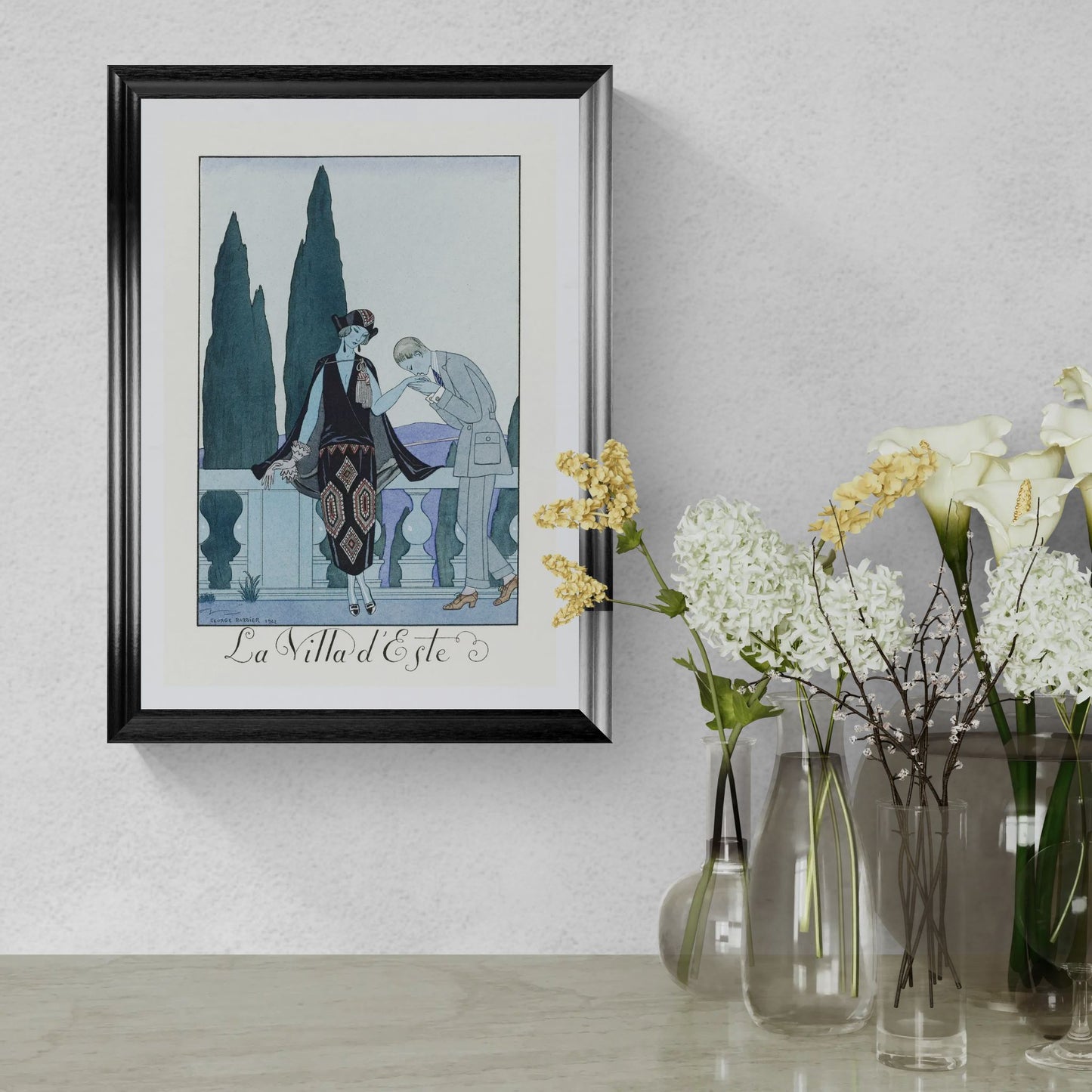 Framed artwork on a wall with decorative vases below