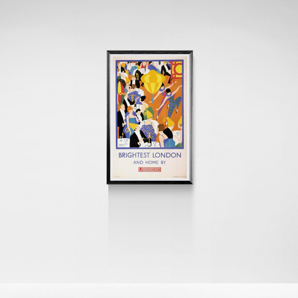 Framed London underground poster with colorful design and text on a white wall