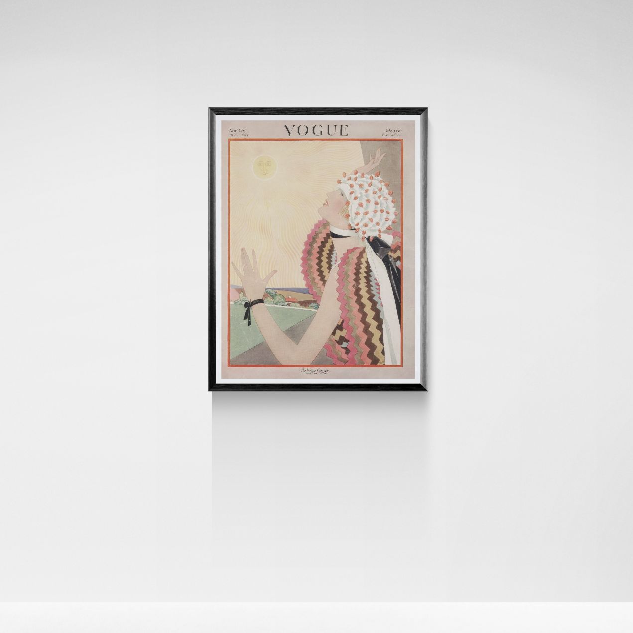 Framed Vogue magazine cover on a white wall