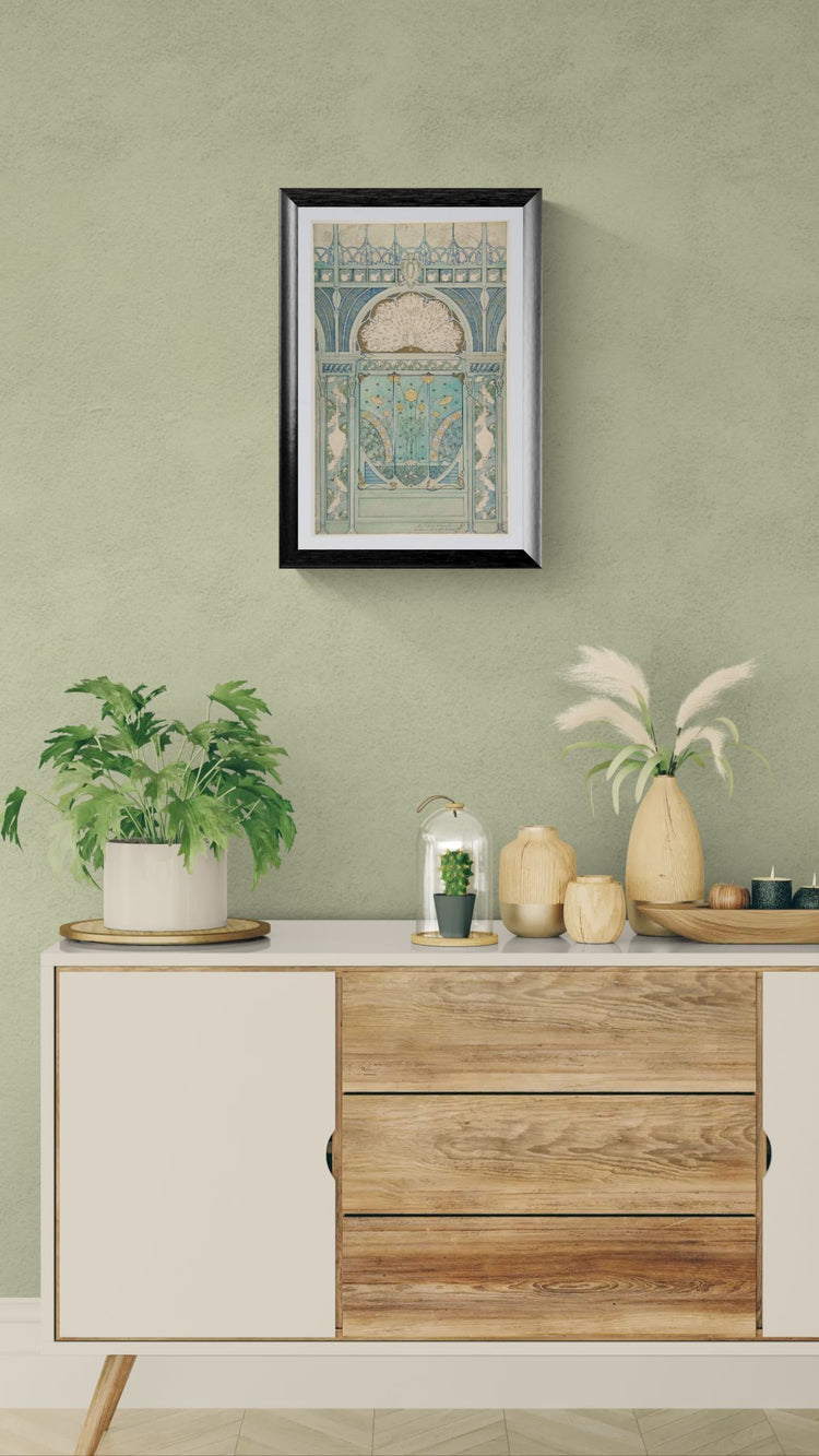Wooden sideboard with decorative items against a green wall with framed art.