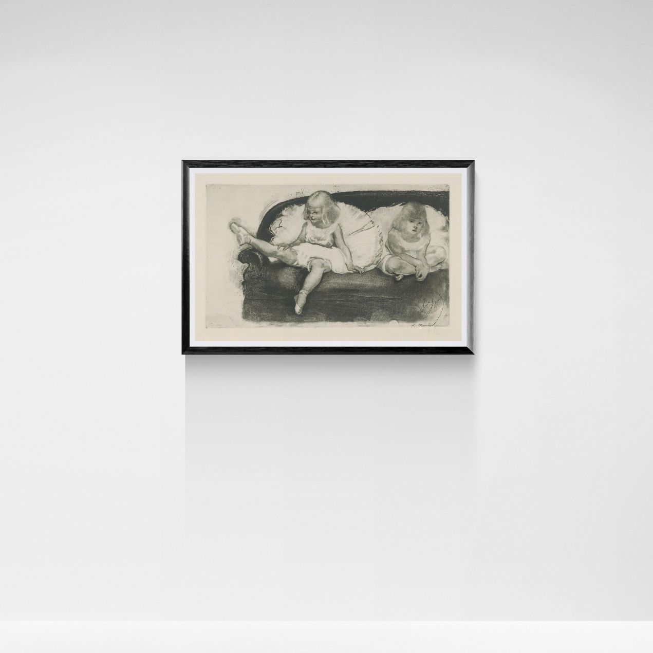 Framed artwork of two young ballerinas on a sofa against a white wall