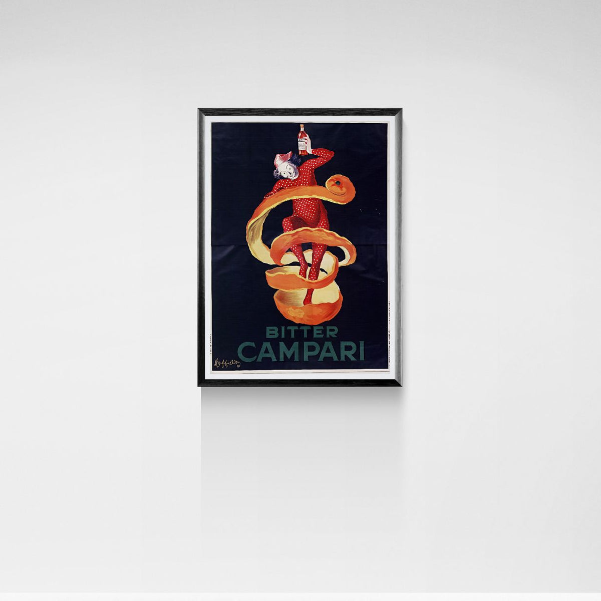 Framed artwork of a character in a red suit with a snake, advertising Bitter Campari on a white wall.
