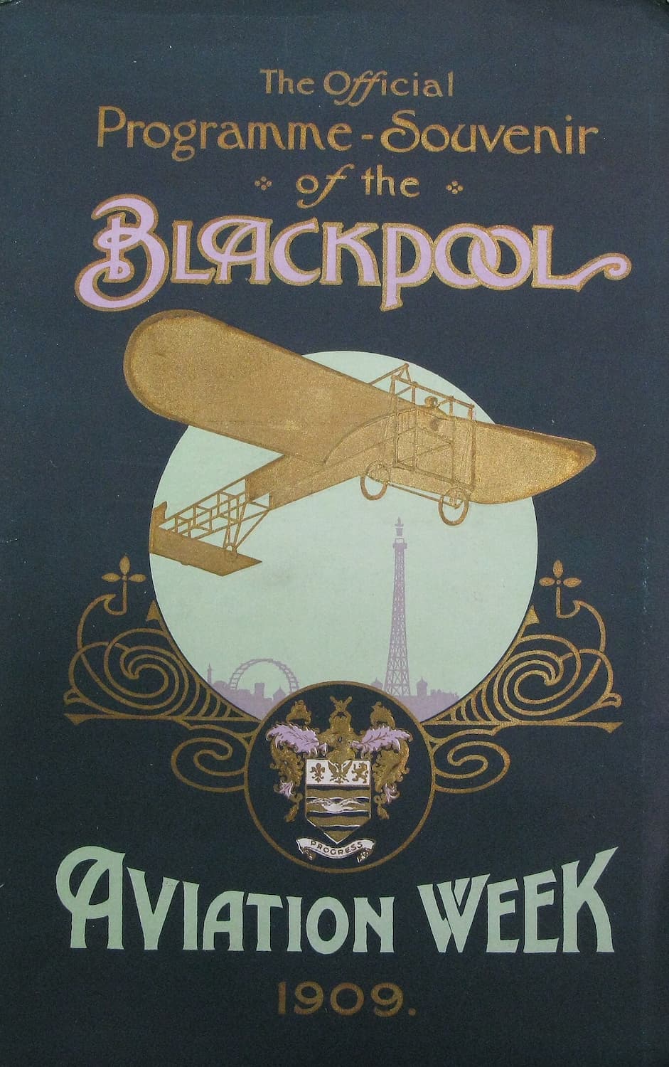 High-quality Giclée reproduction of the 1909 Blackpool Aviation Week Programme cover, featuring a gold early aeroplane illustration over the Blackpool Tower silhouette on a dark background, vintage print.