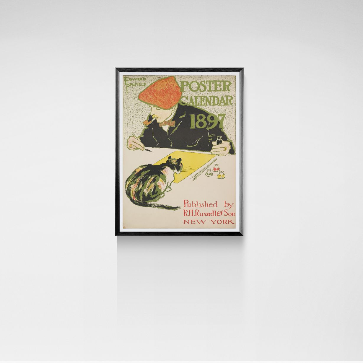 Framed vintage calico cat poster calendar from 1891 on a white wall