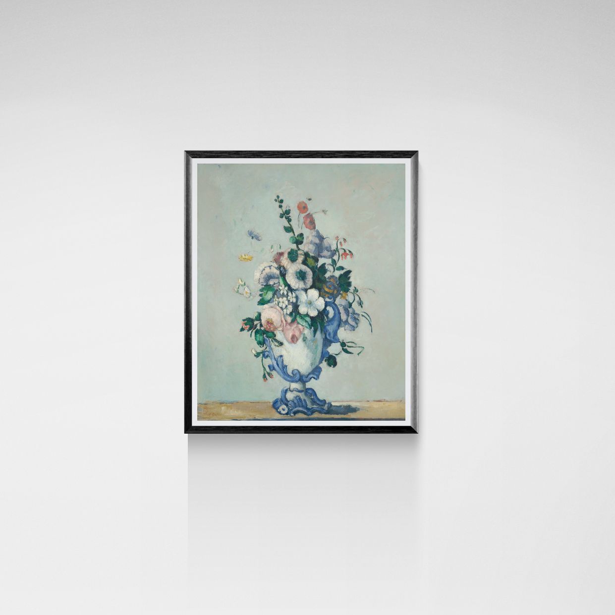Framed artwork of a floral arrangement in a blue vase on a light gray background