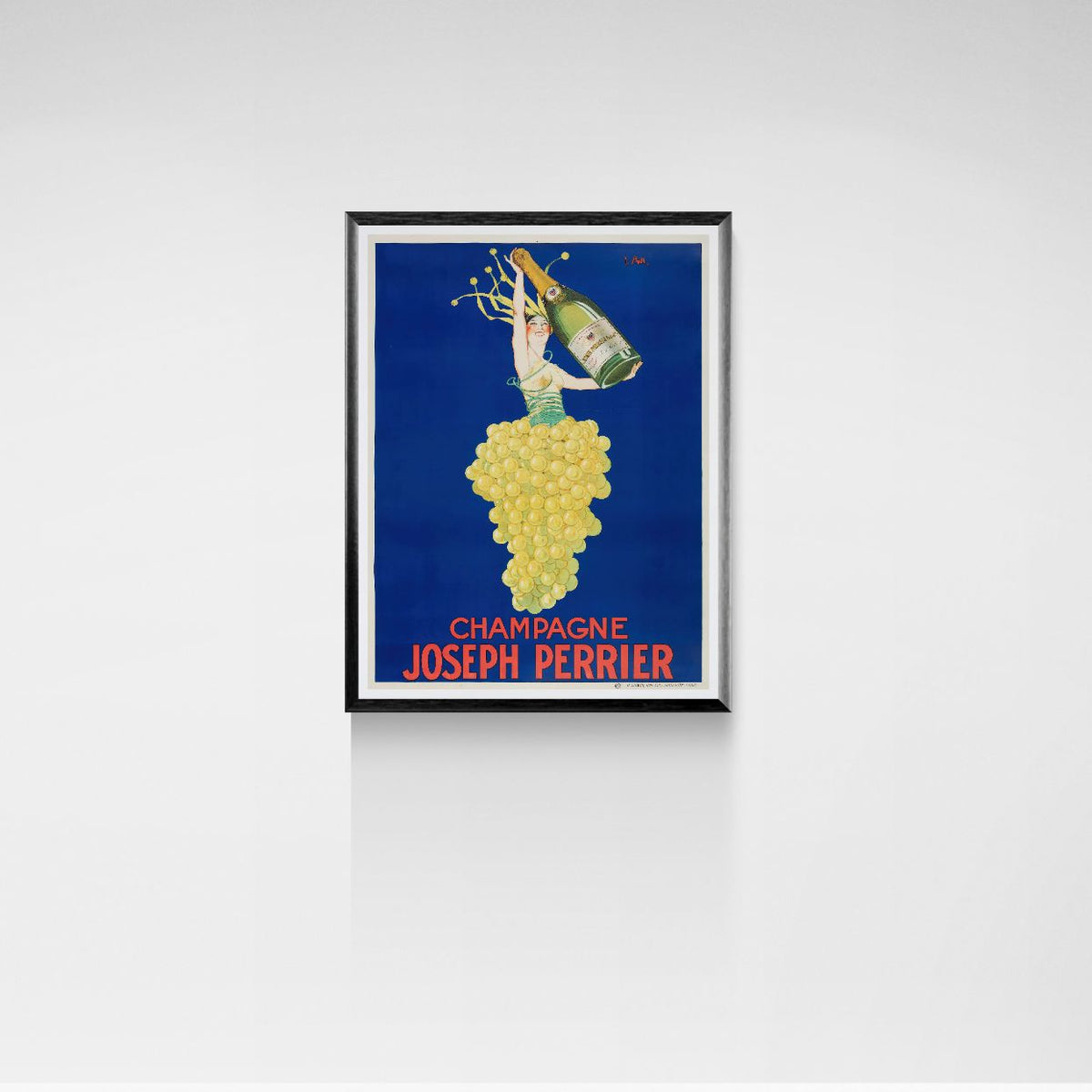 Framed poster of Champagne Joseph Perrier with a person pouring champagne from grapes against a blue background.