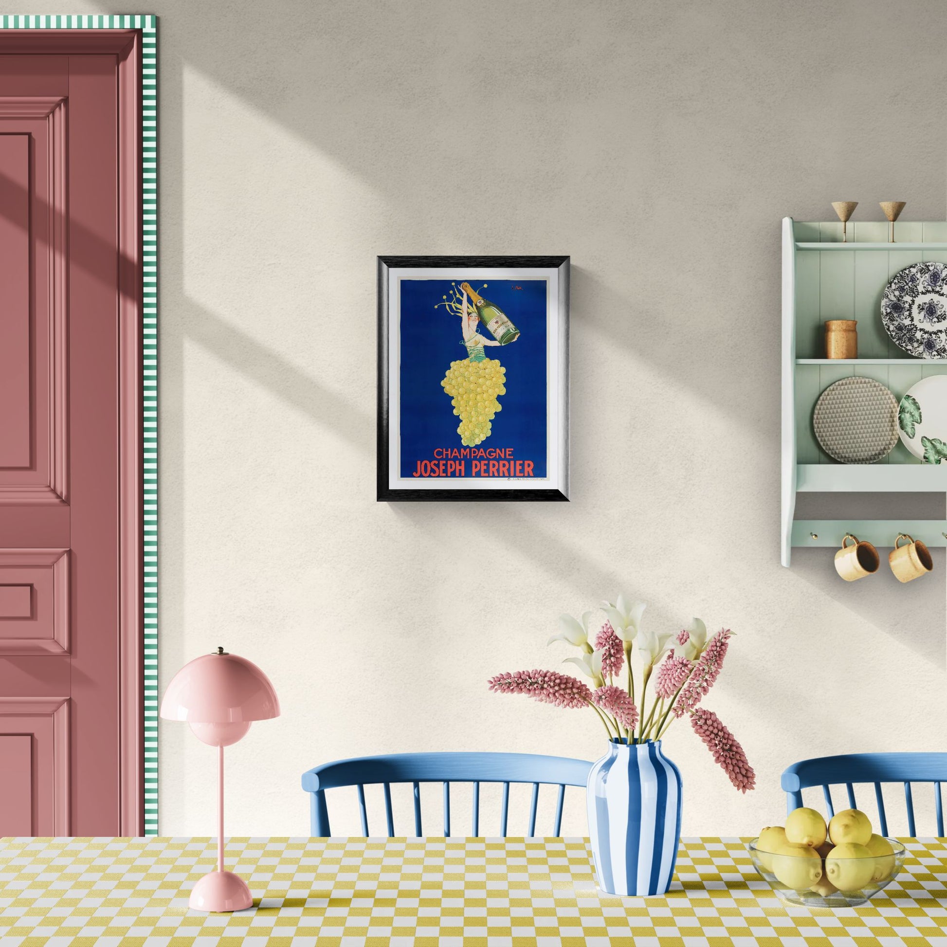 Dining room with a framed poster on the wall, pink lamp, blue chairs, and a checkered tablecloth.