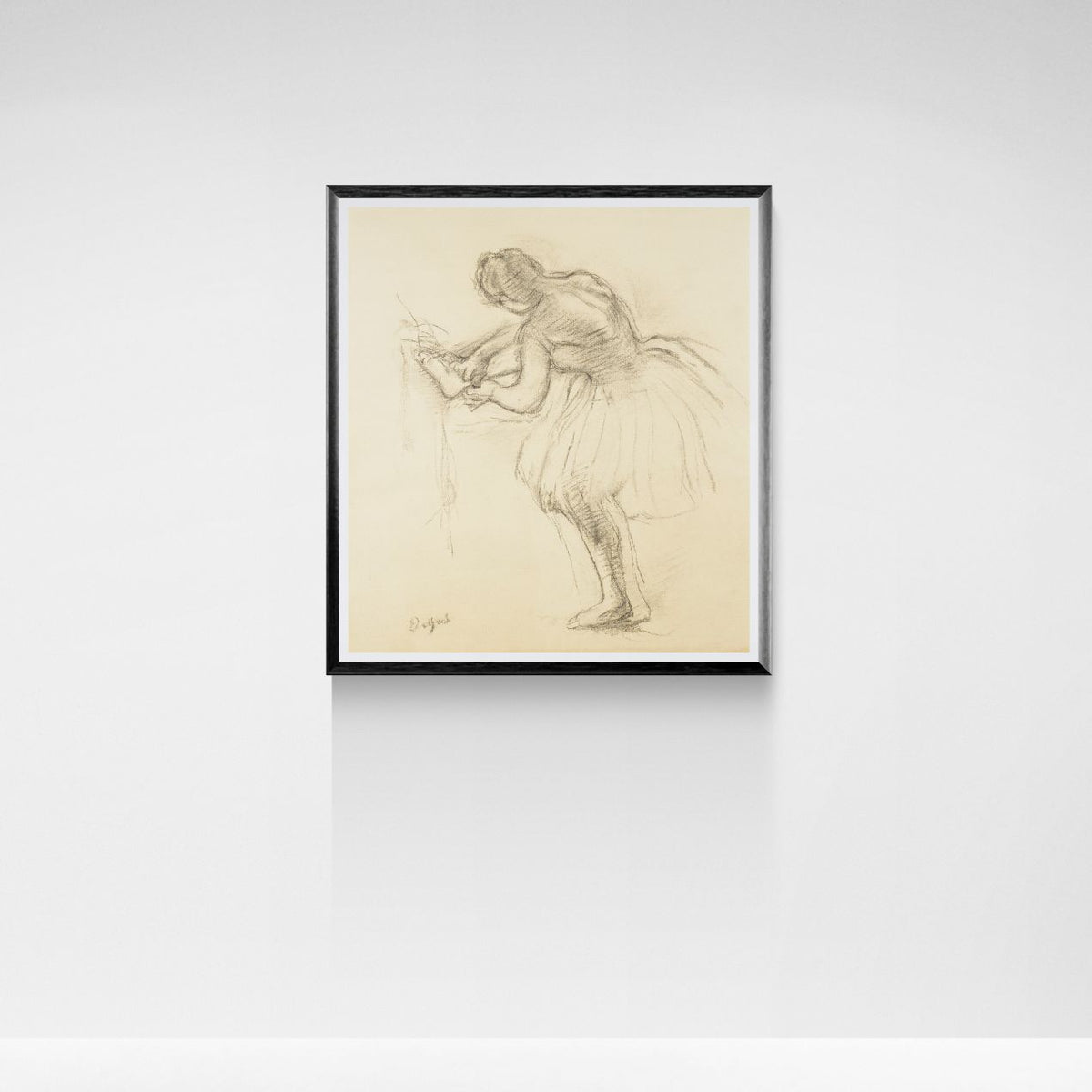 Framed artwork of a dancer on a white wall