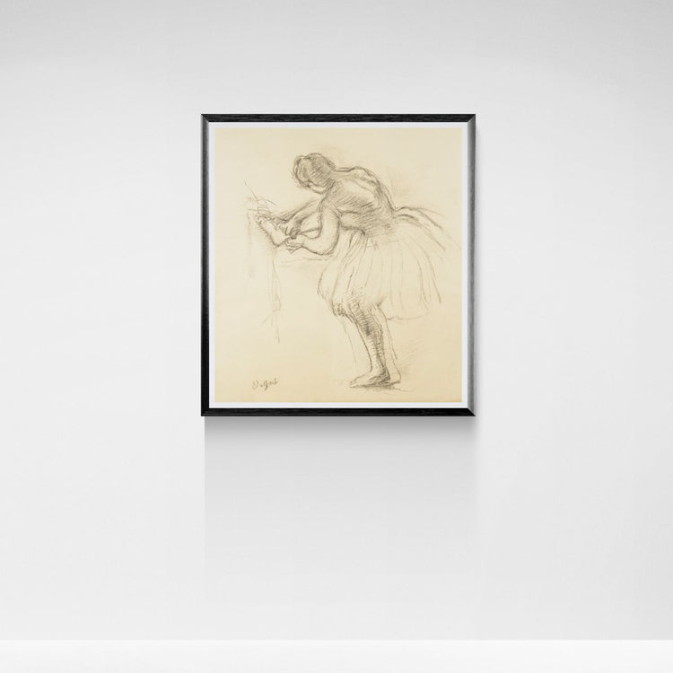 Framed artwork of a dancer on a white wall