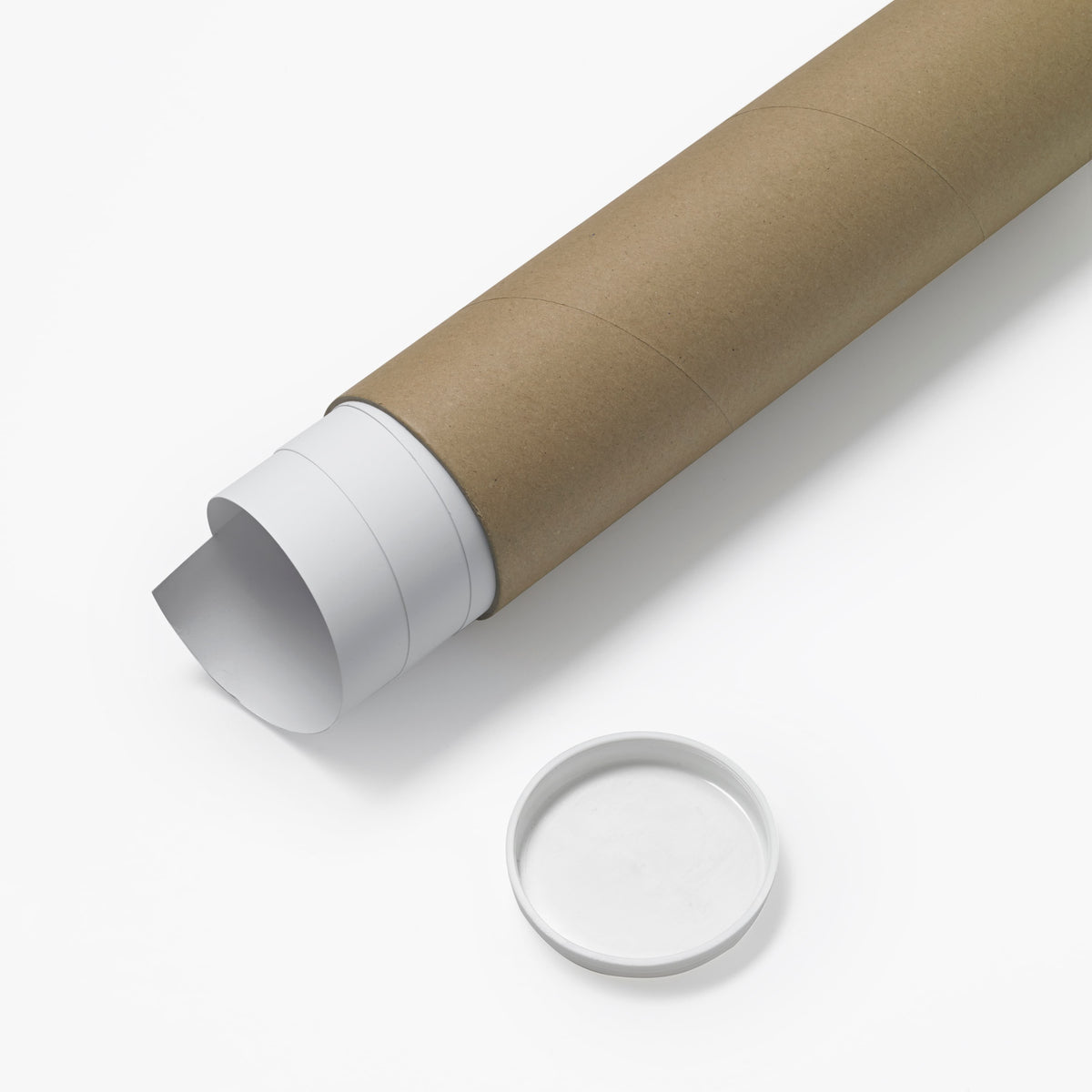 Roll of brown paper with a white paper tube on a white background