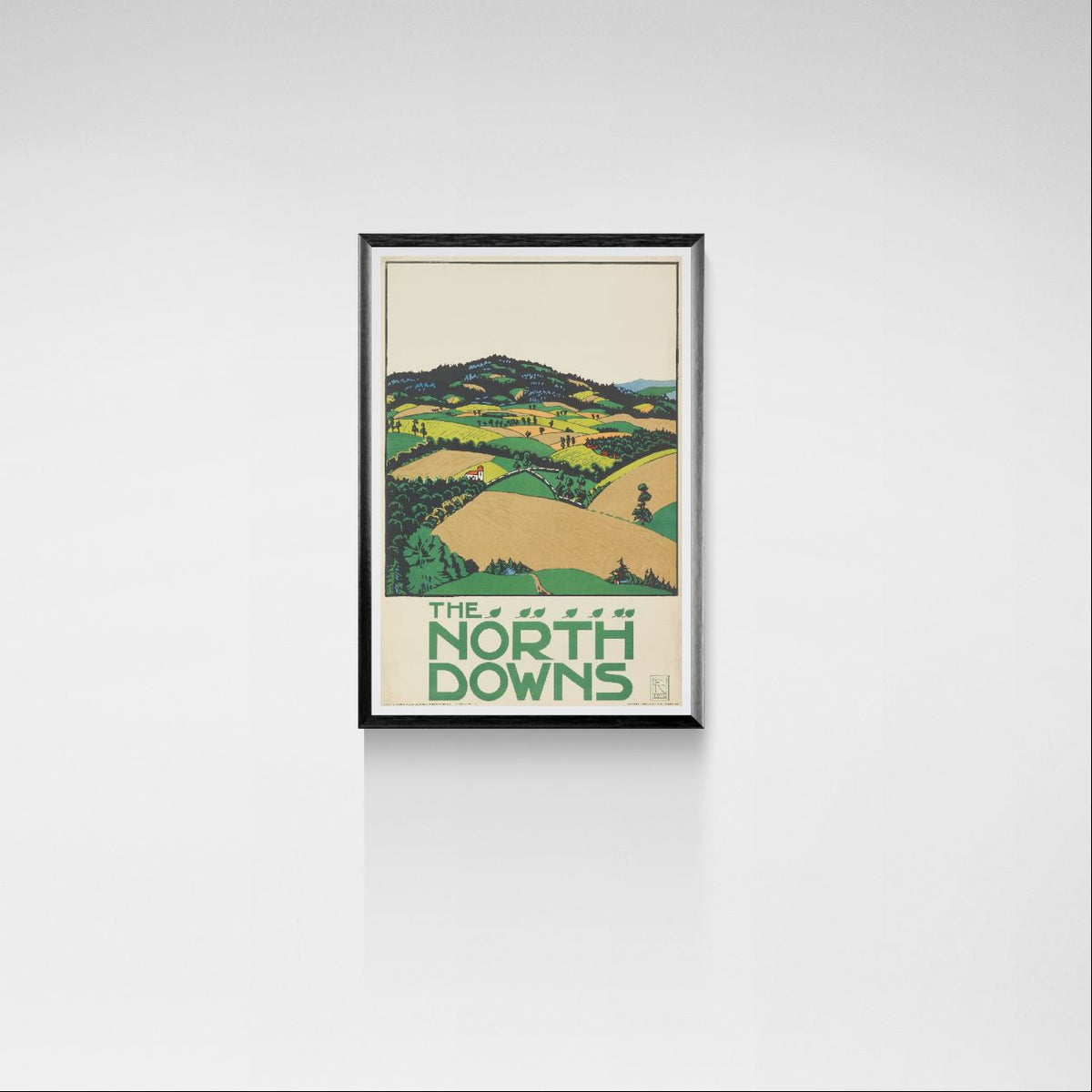 Framed poster of 'The North Downs' landscape on a white wall