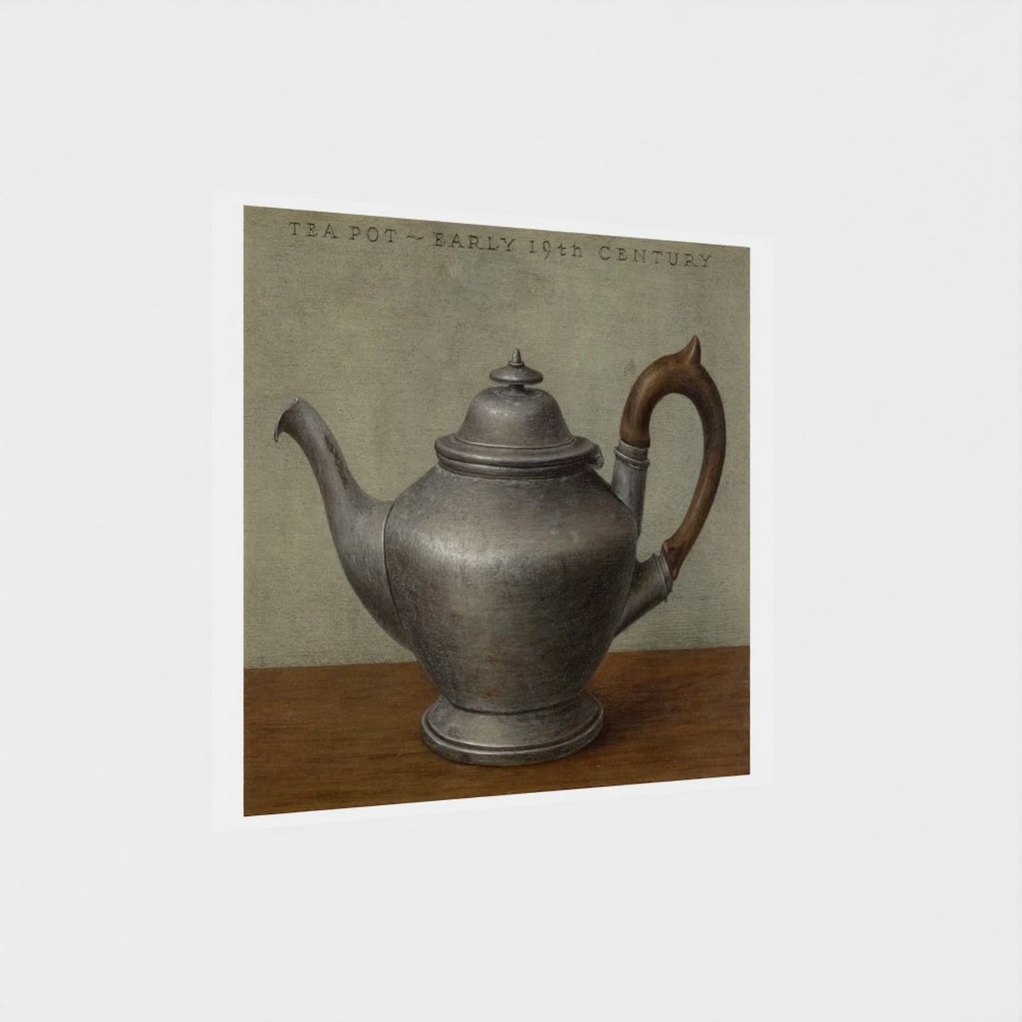 Vintage silver teapot on a wooden surface with a neutral background