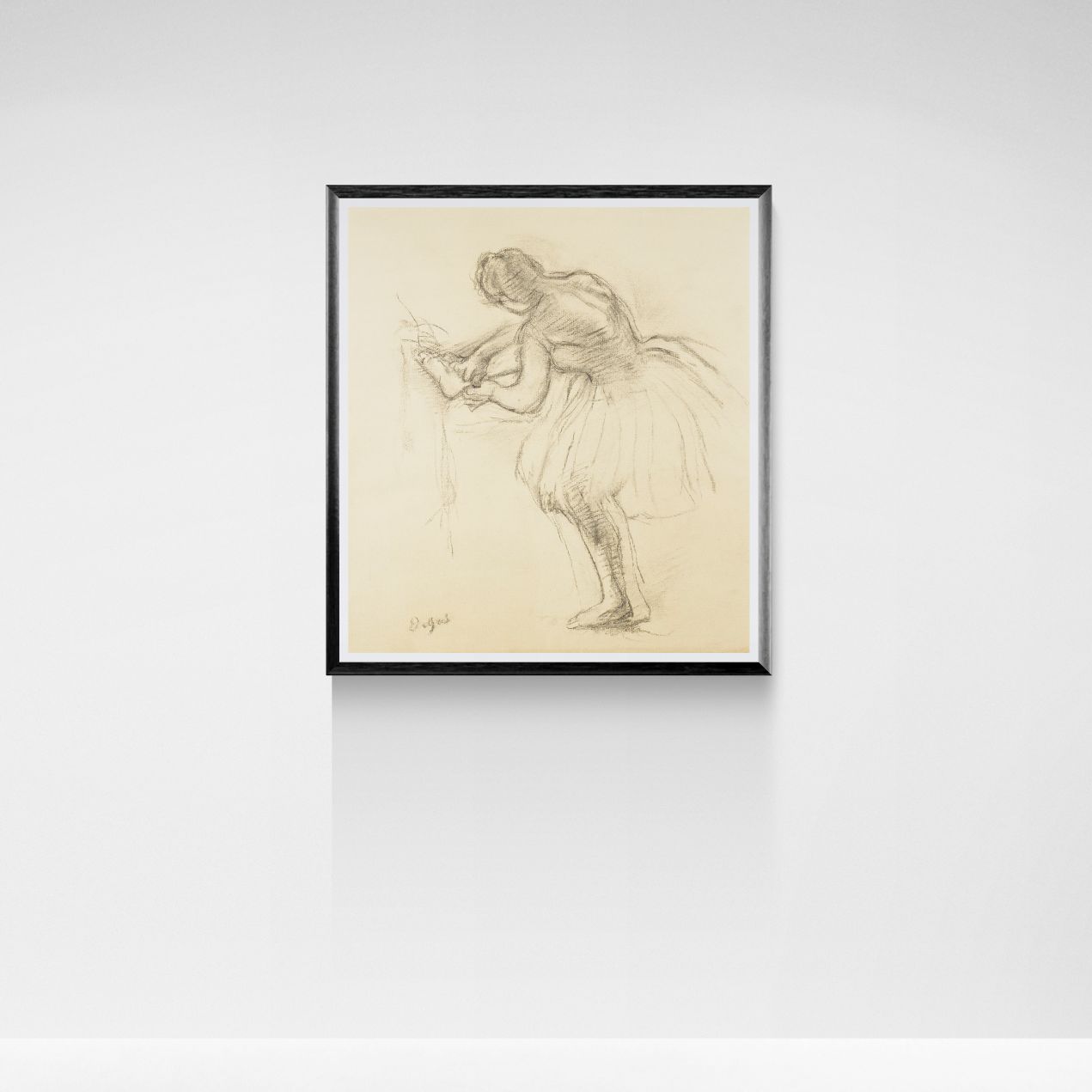 Framed artwork of a dancer on a white wall
