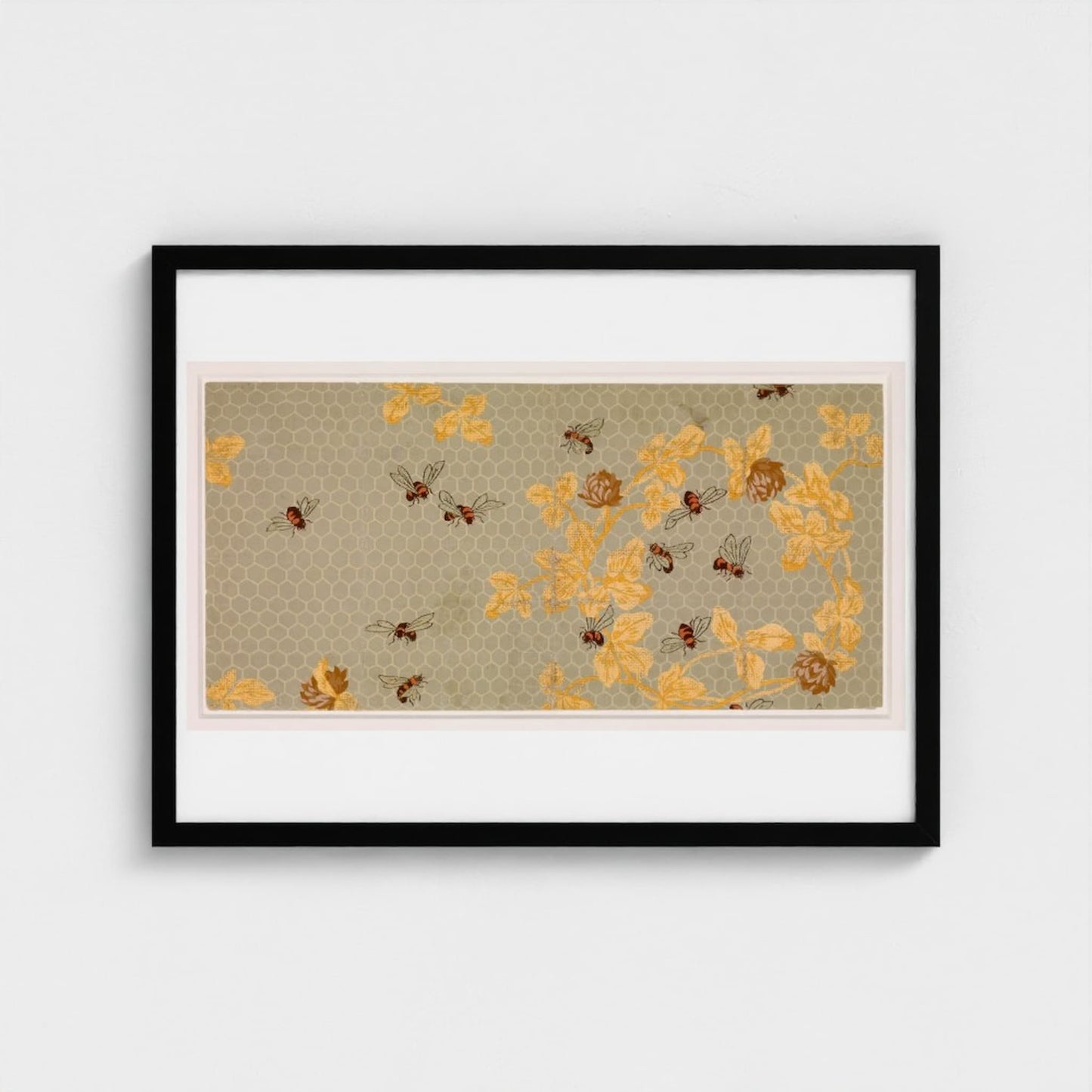 Framed artwork with yellow floral pattern on a beige background