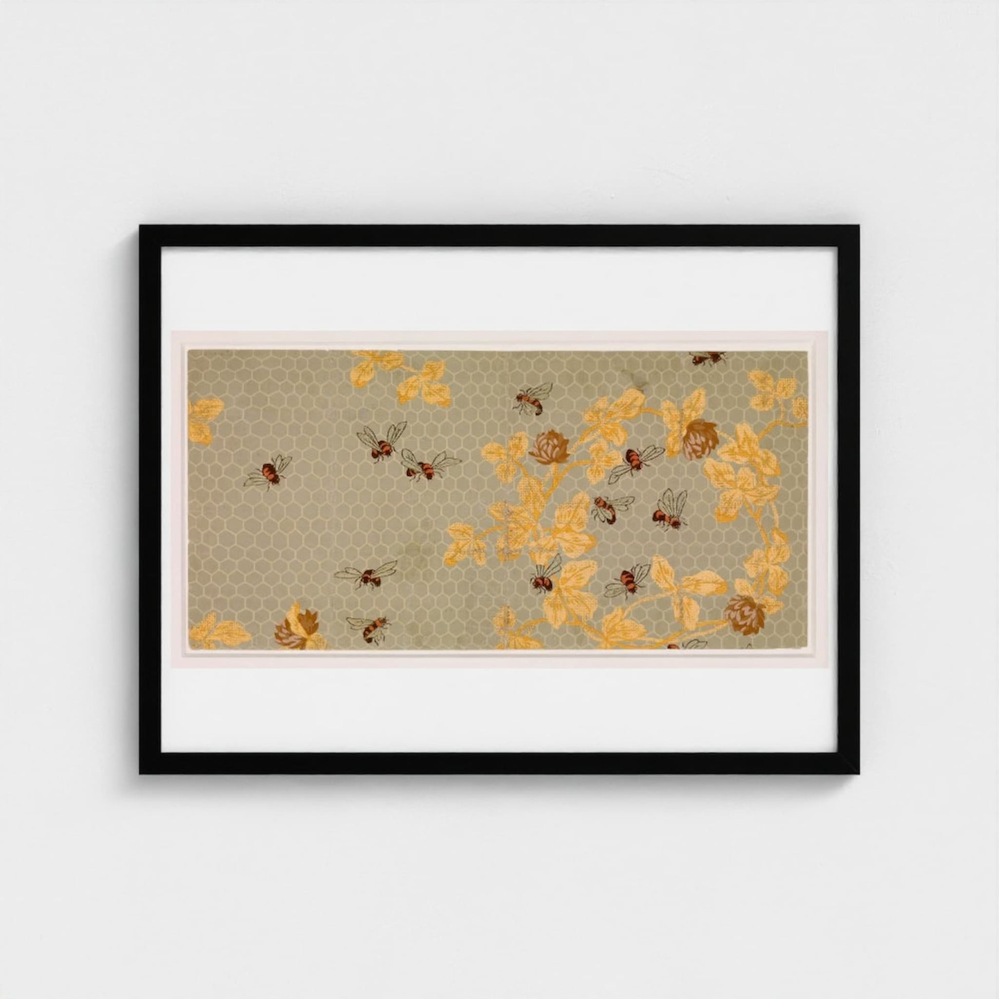 Framed artwork with yellow floral pattern on a beige background