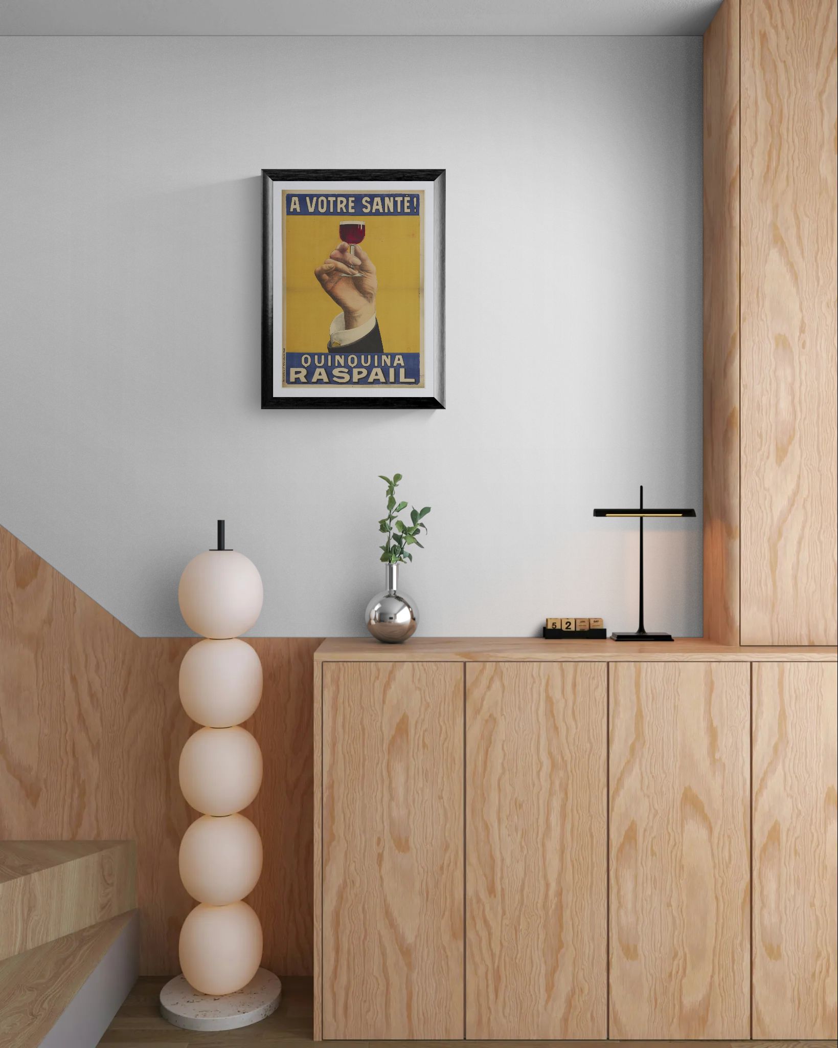 Modern interior with wooden cabinets, a decorative lamp, and a vintage-style poster on the wall.