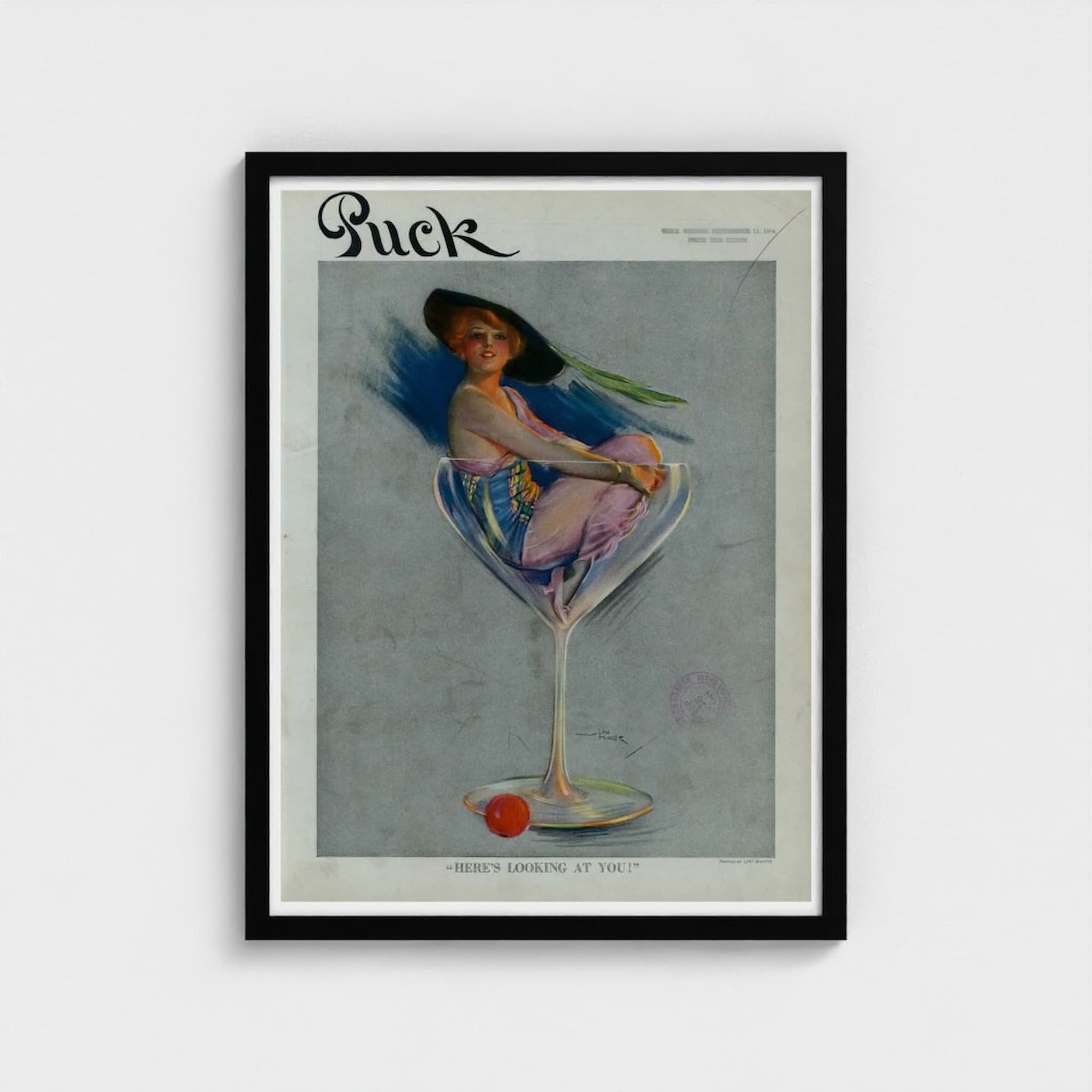 Framed vintage magazine cover of 'Puck' with a woman in a glass