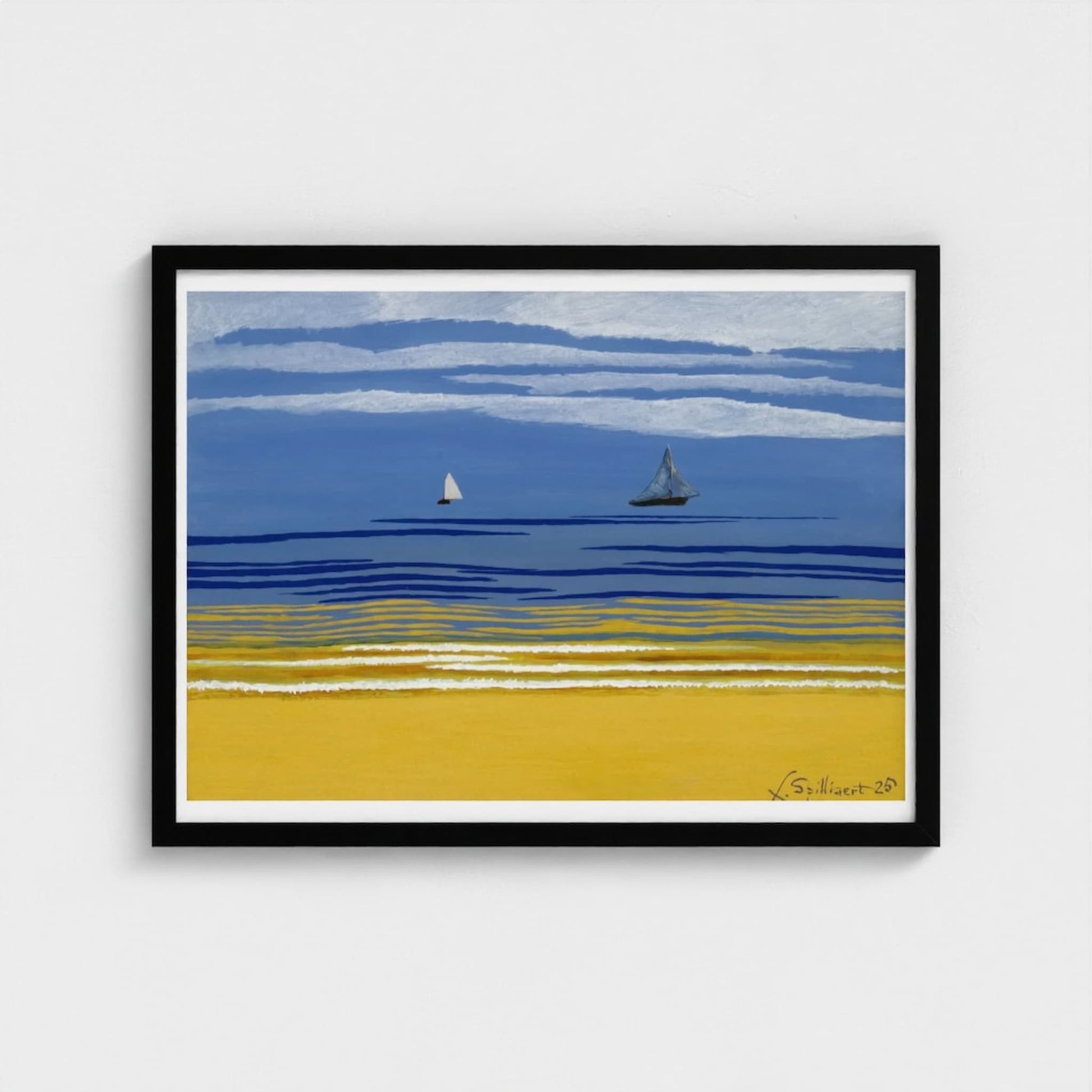 Framed artwork of two sailboats on a blue sky and yellow sand beach.