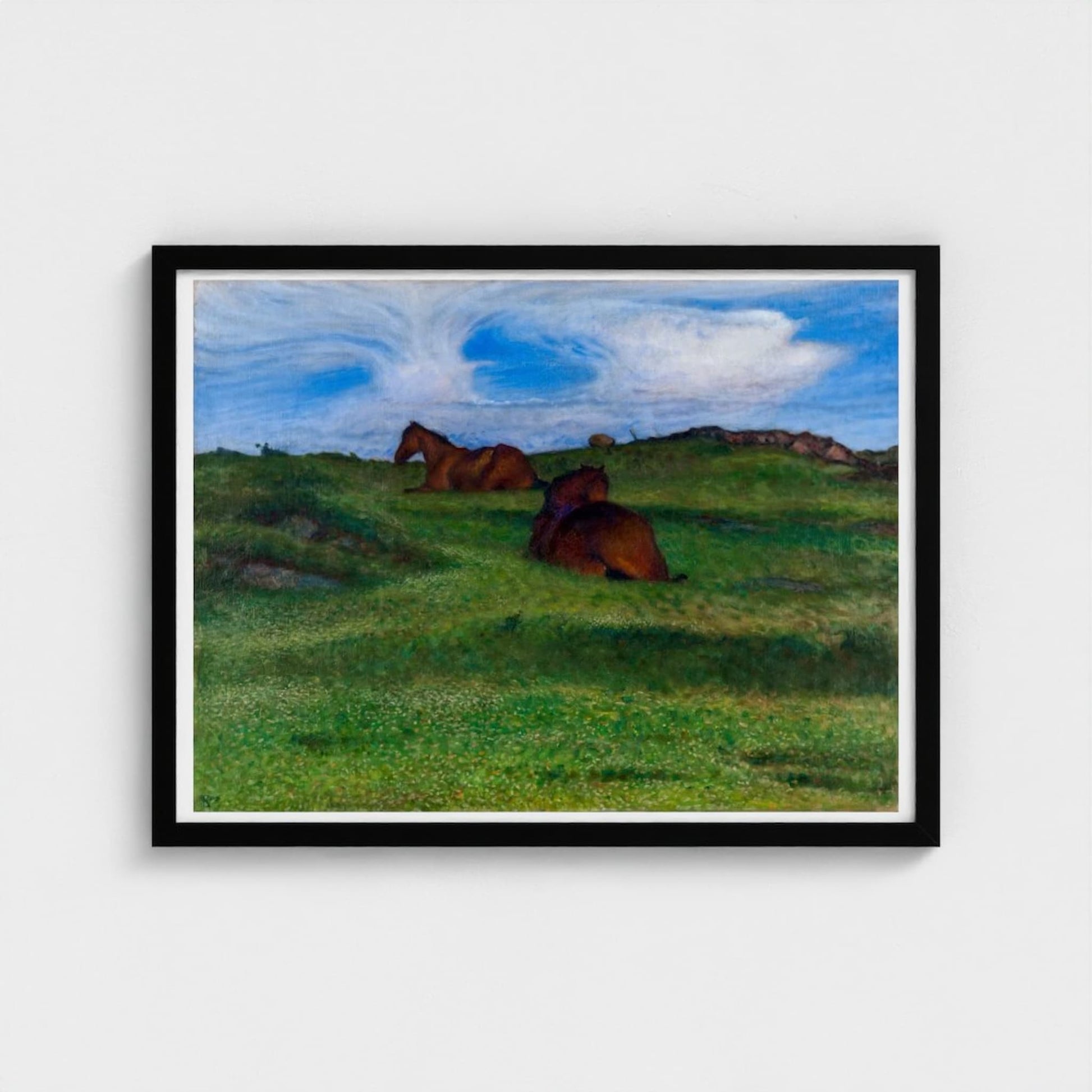 Framed artwork of two horses in a grassy field with a blue sky.