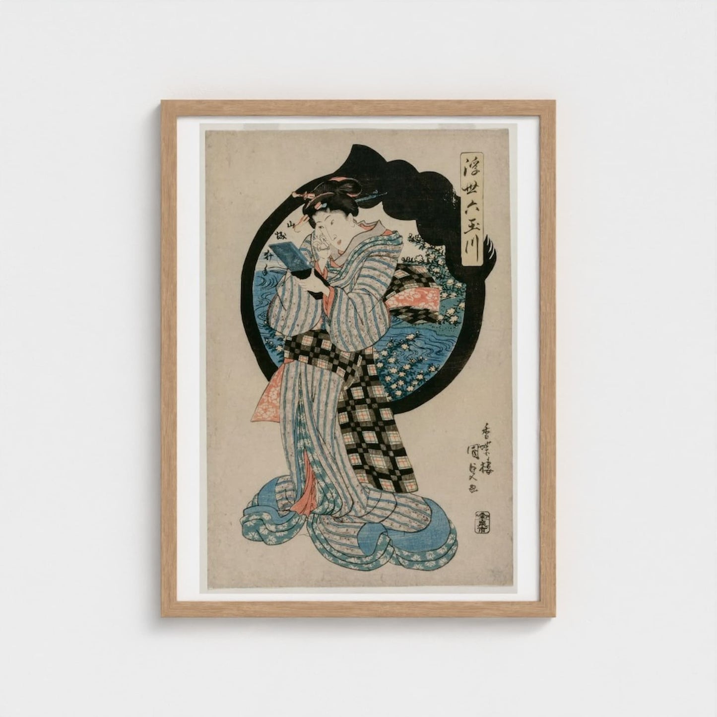 Framed artwork of a traditional Japanese print with a woman in a kimono on a white background