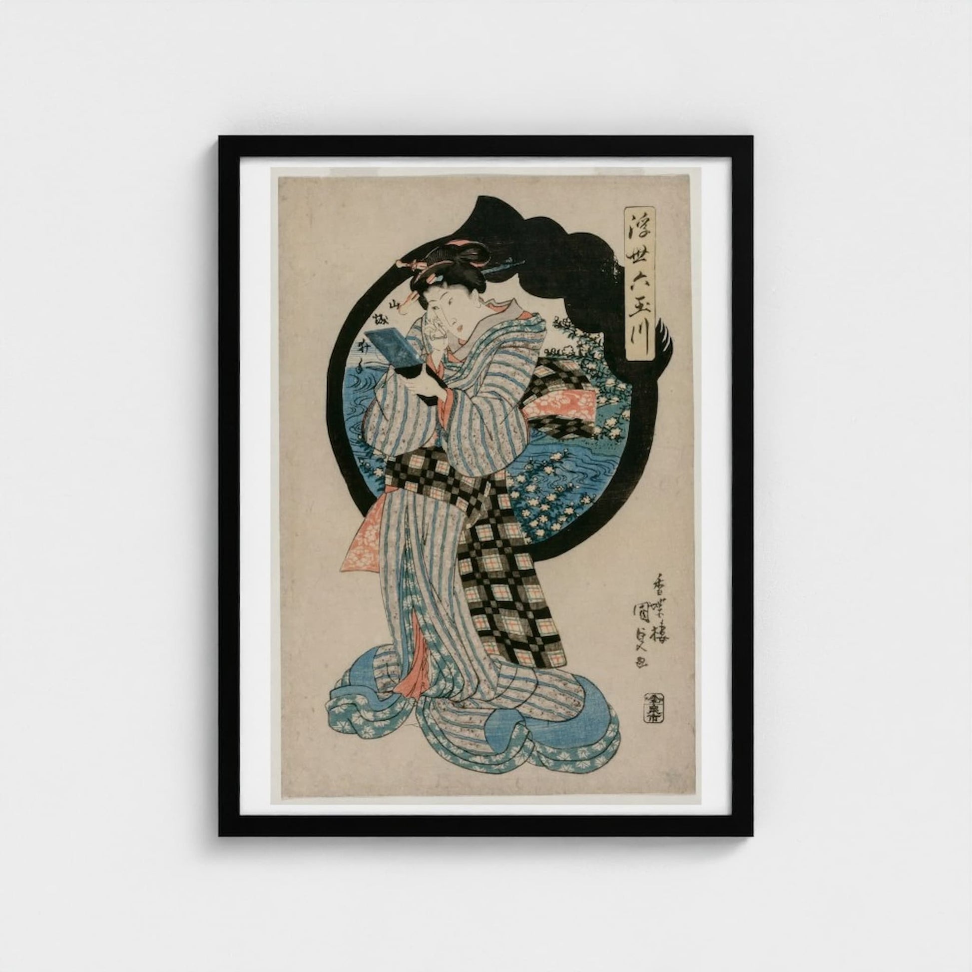 Framed artwork of a traditional Japanese print with a woman in a kimono on a beige background