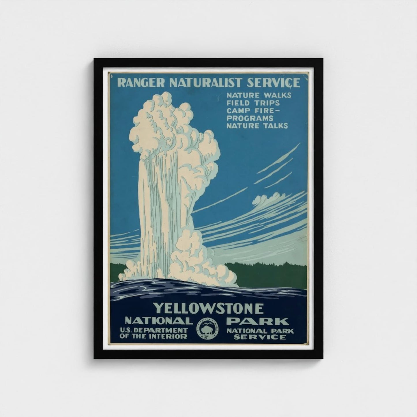 Framed Yellowstone National Park poster with a waterfall illustration on a blue background.