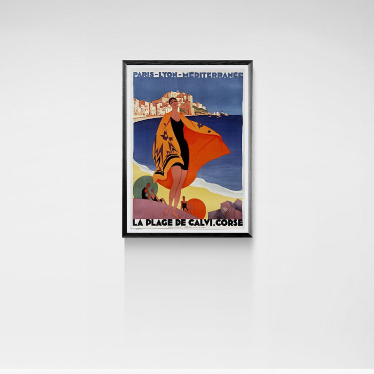 Framed vintage-style travel poster of a beach scene with a woman in an orange dress.