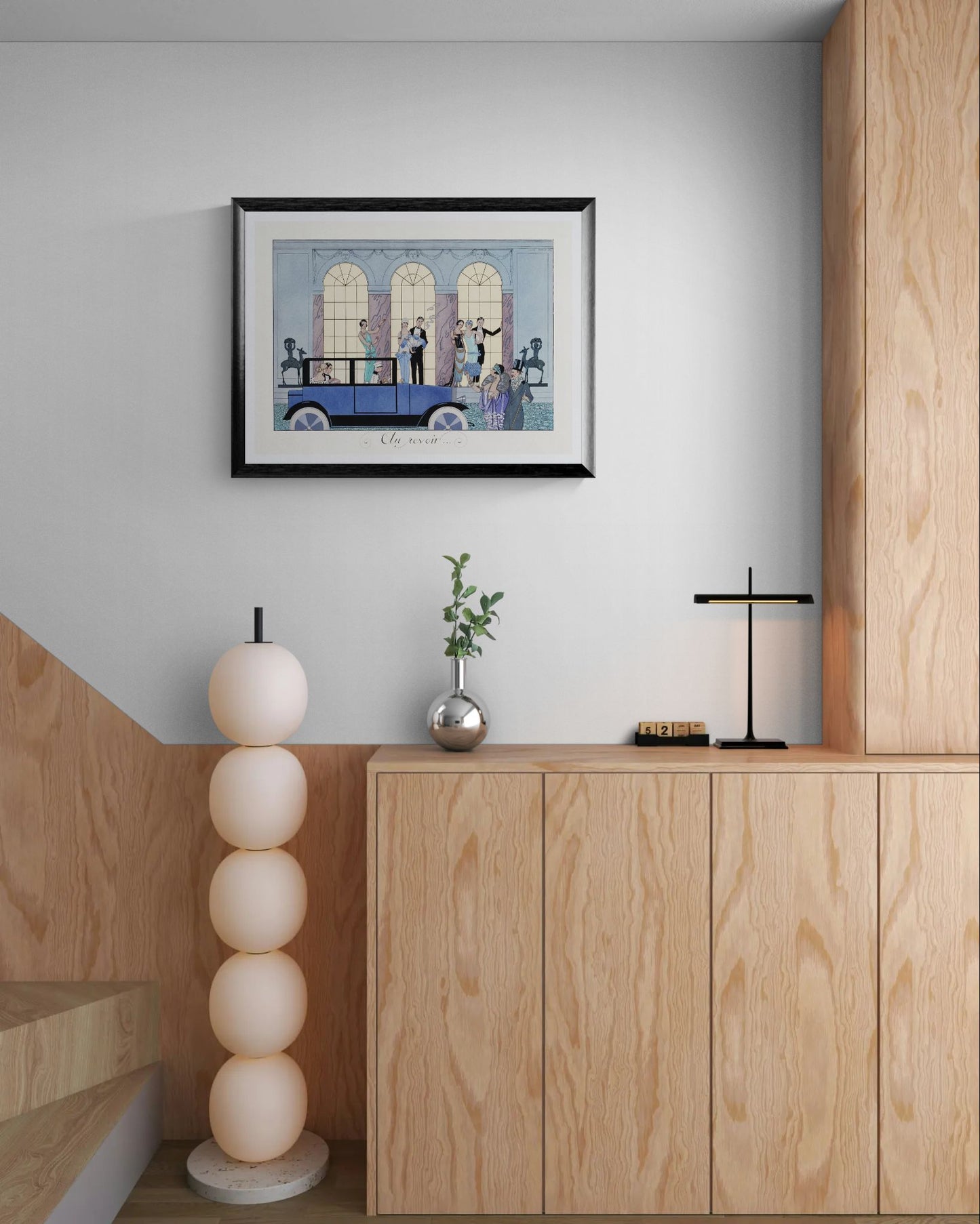 Modern interior with wooden cabinets, a framed artwork, and decorative items.
