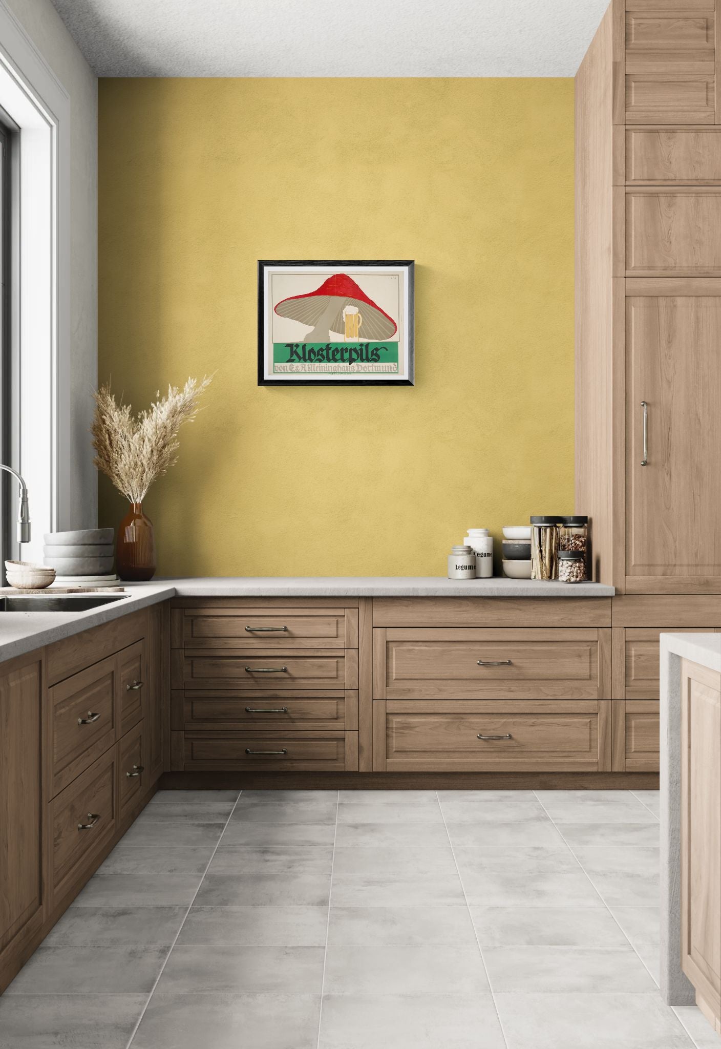 Kitchen interior with wooden cabinets, yellow wall, and framed artwork.