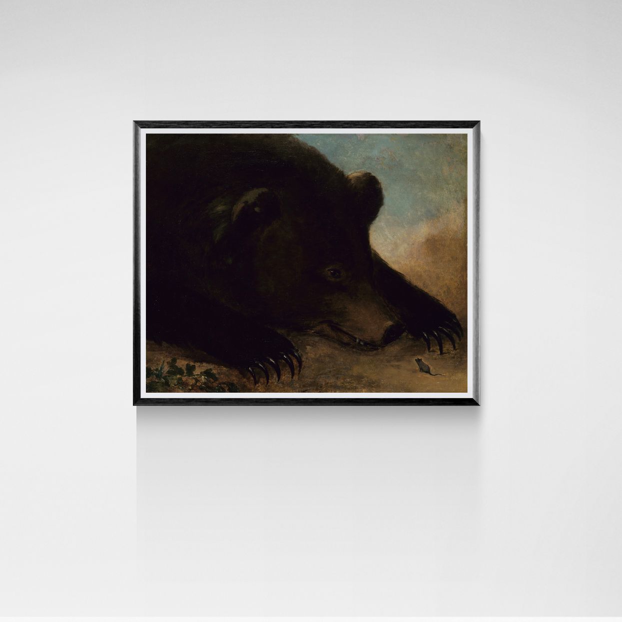 Framed painting of a bear on a white wall