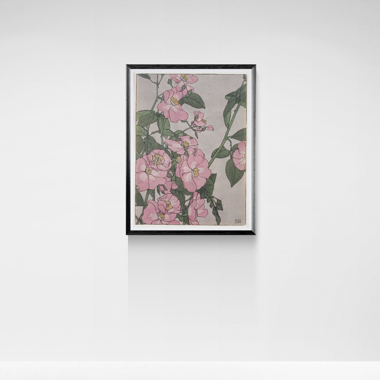 Framed artwork of pink floral design on a white wall