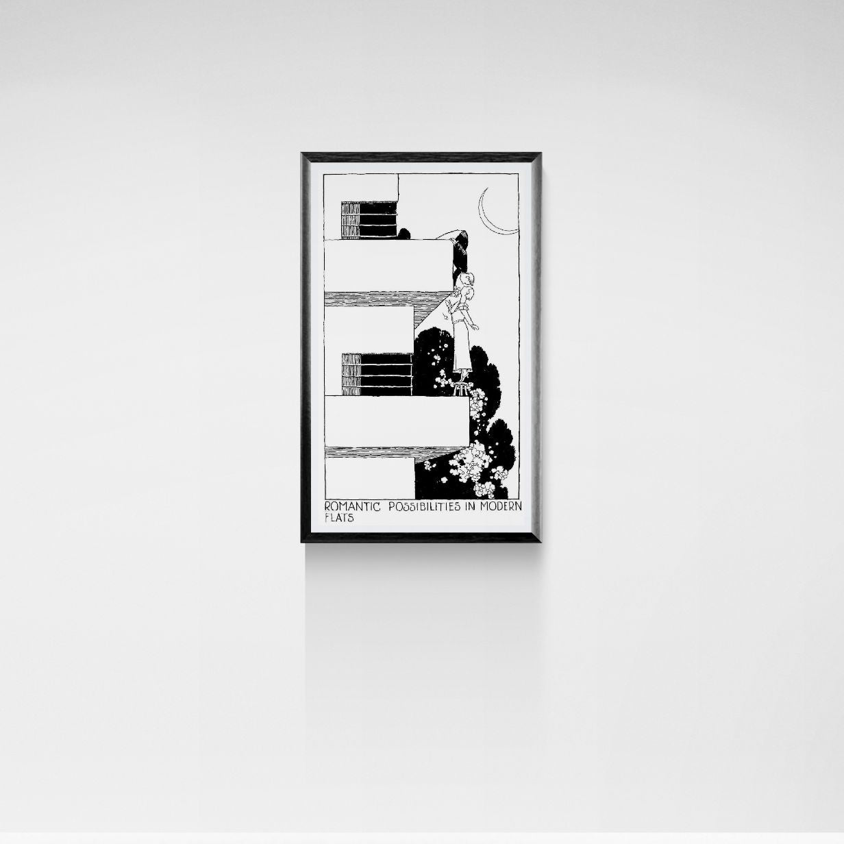 Framed black and white artwork on a white wall