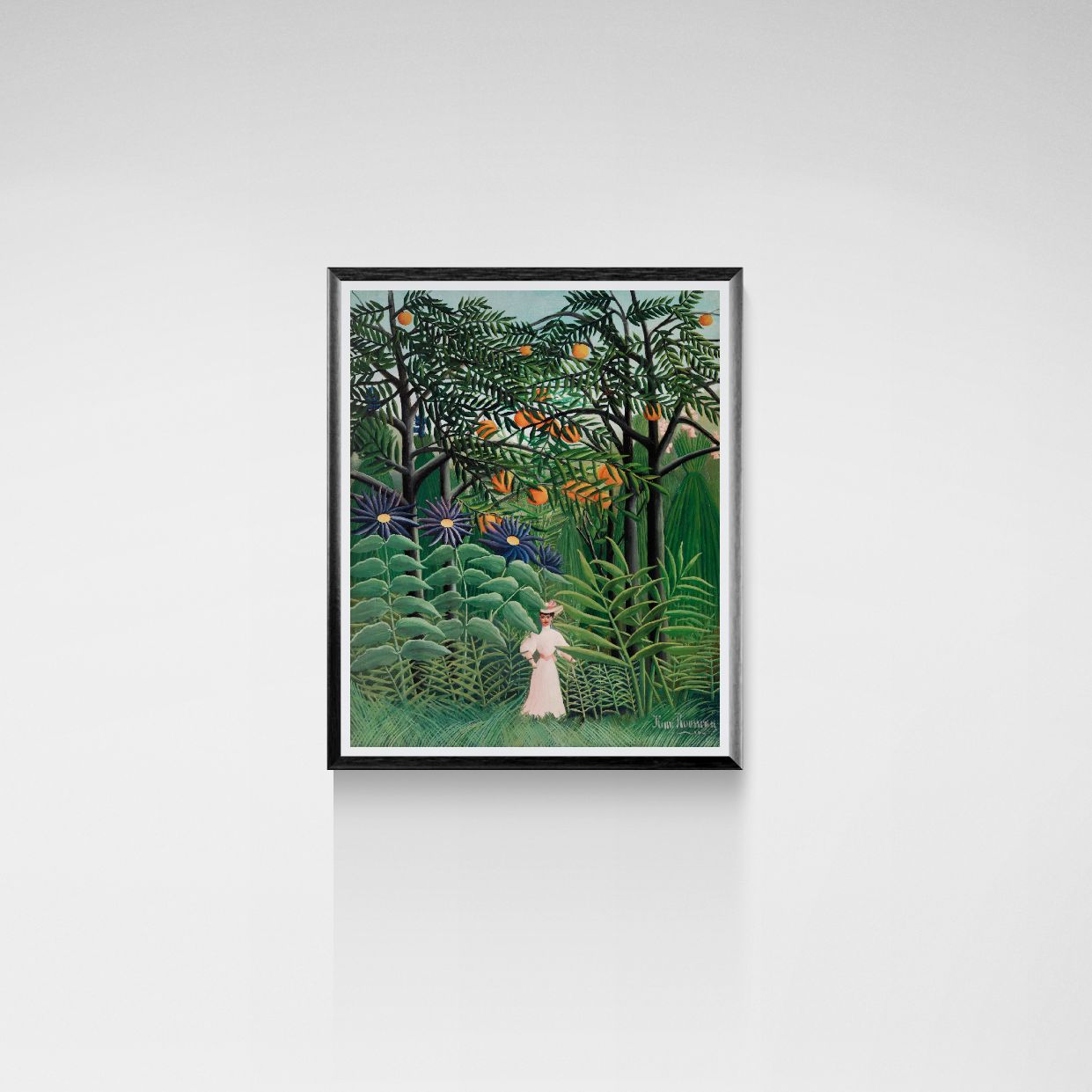 Framed artwork of a woman in a garden with lush greenery and birds on a white wall.