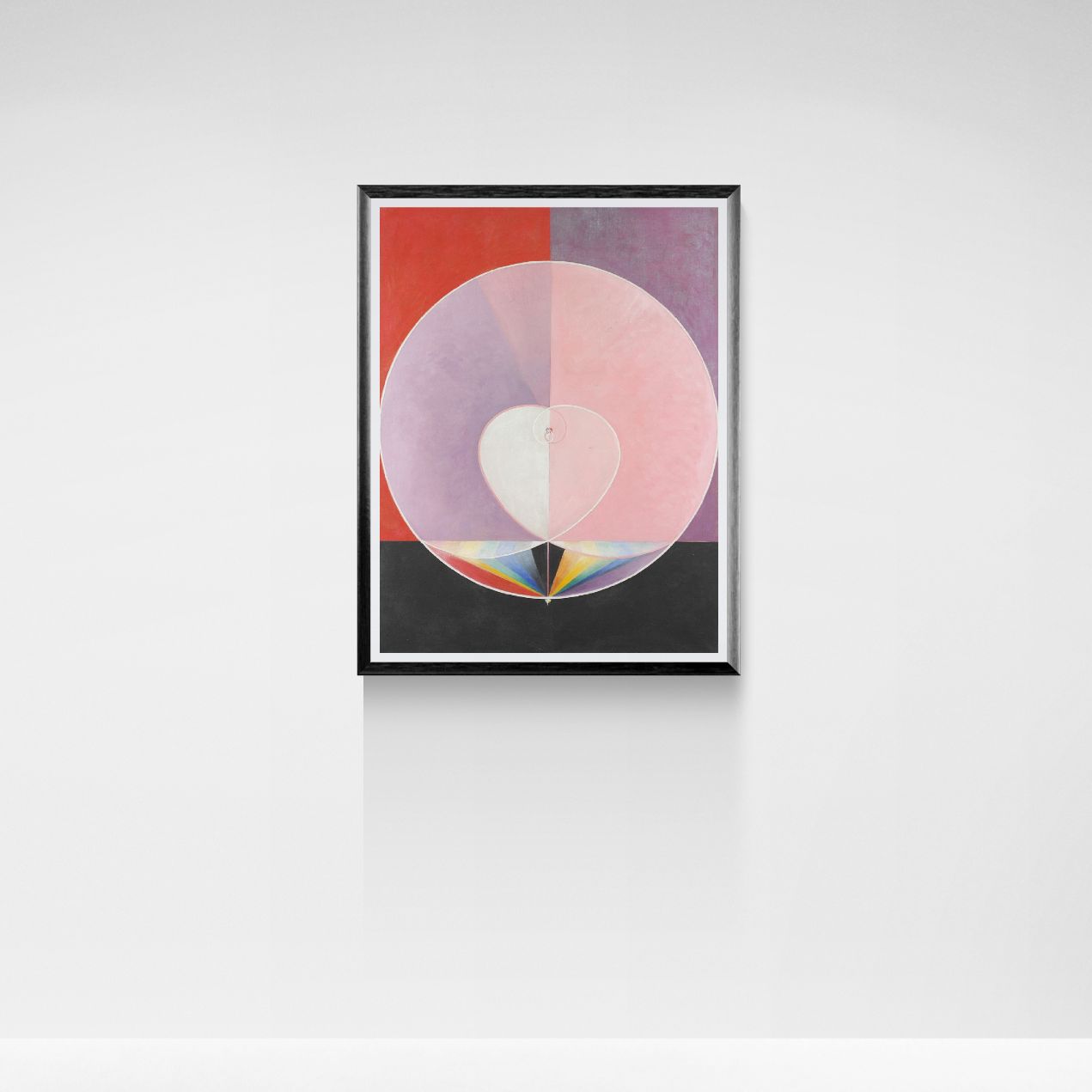 Framed abstract art print with colorful circles on a white wall