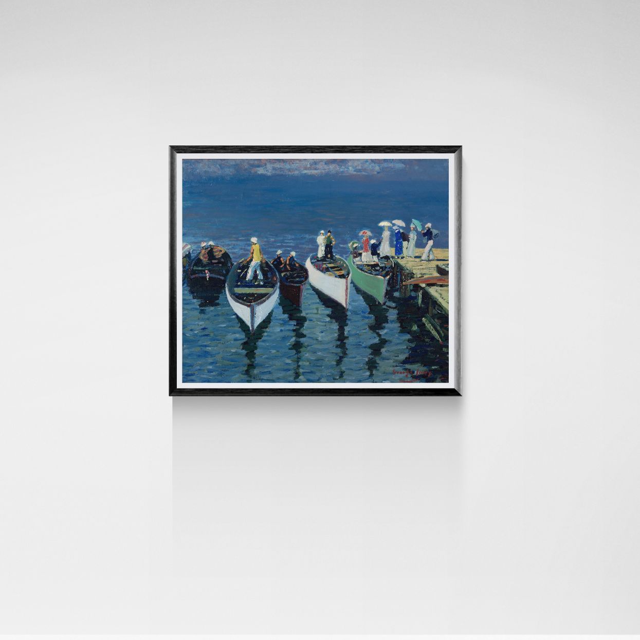 Framed artwork of a harbor scene with boats and people on a white wall.