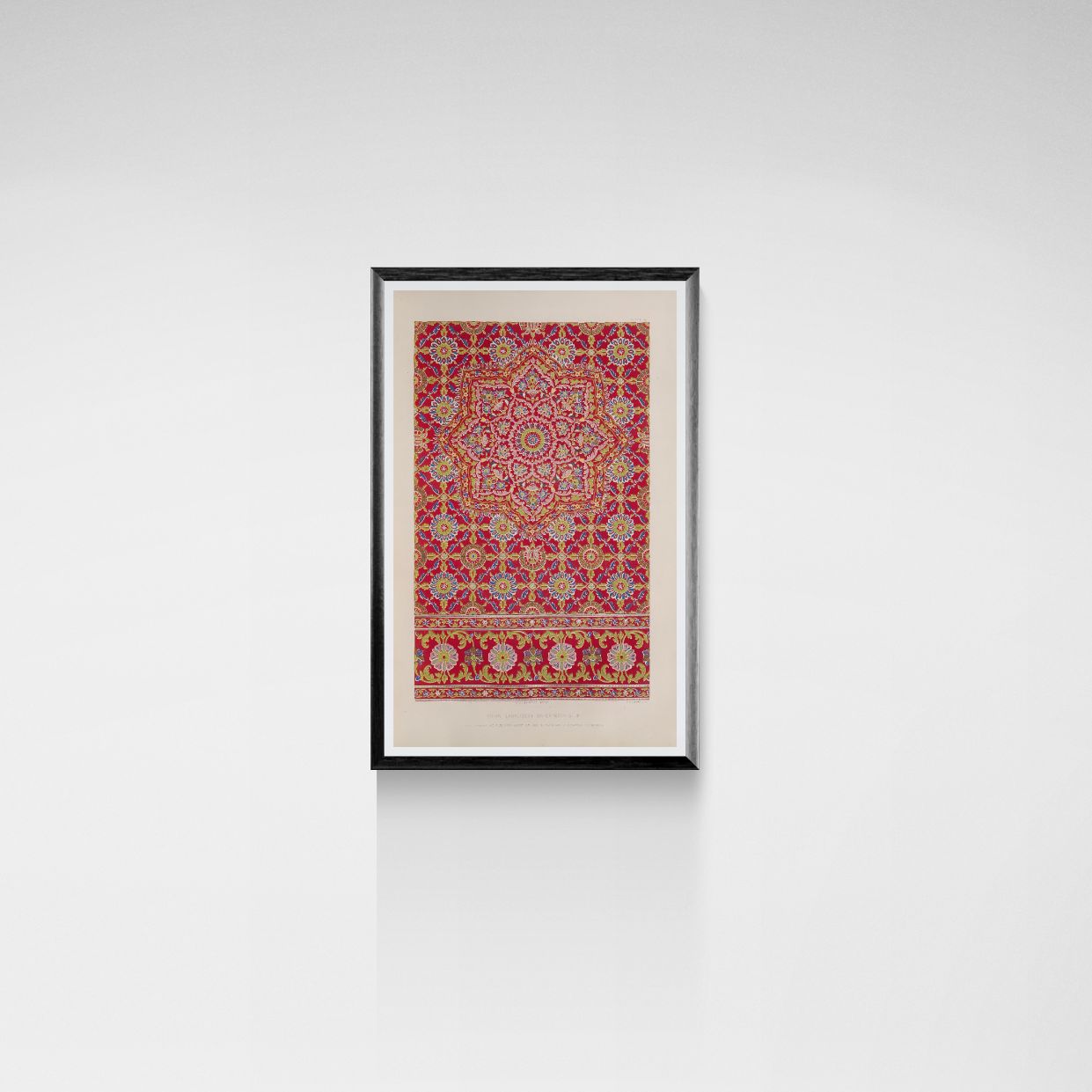 Framed artwork with a red and gold pattern on a white wall