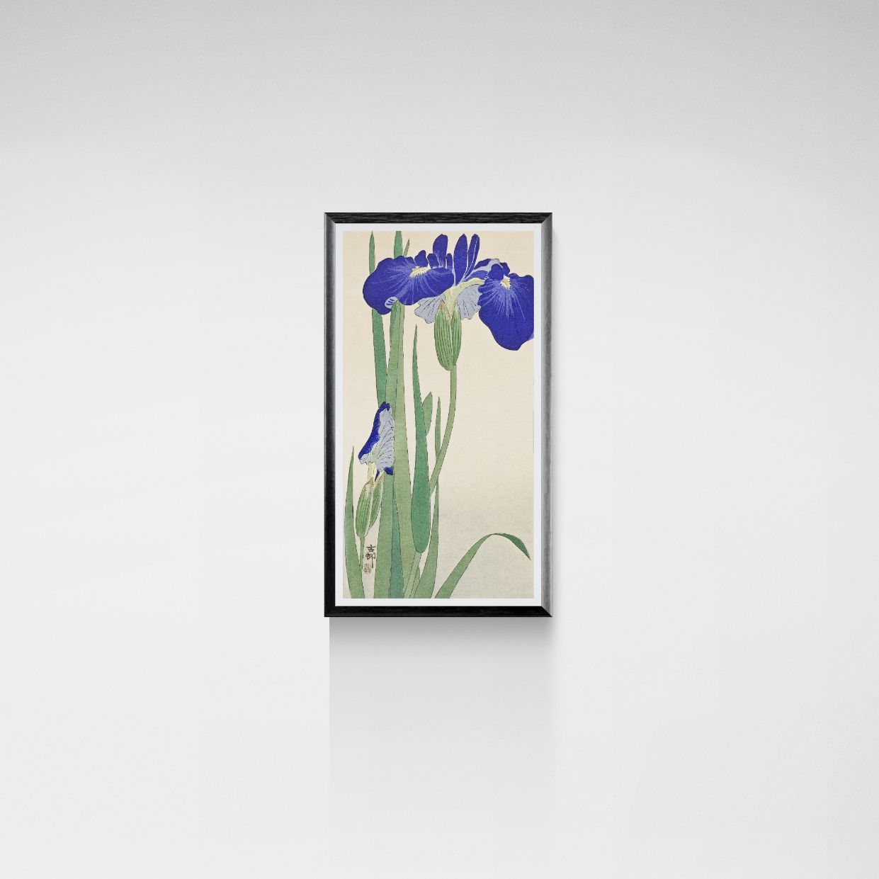 Framed artwork of blue flowers on a beige background