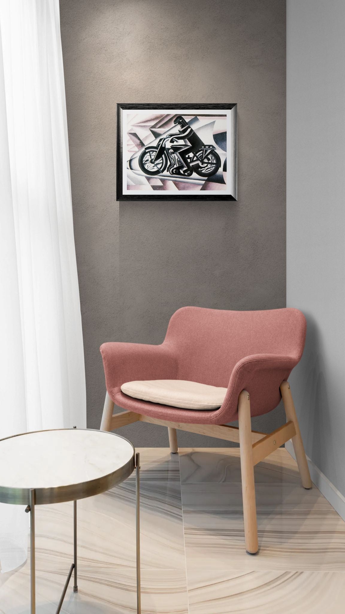 Pink chair with wooden legs in a room with a framed picture on the wall.