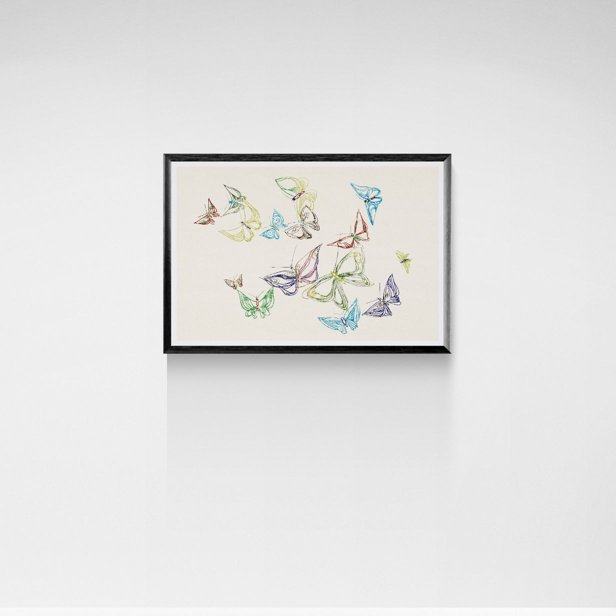 Framed artwork of colorful butterfly illustrations on a white wall
